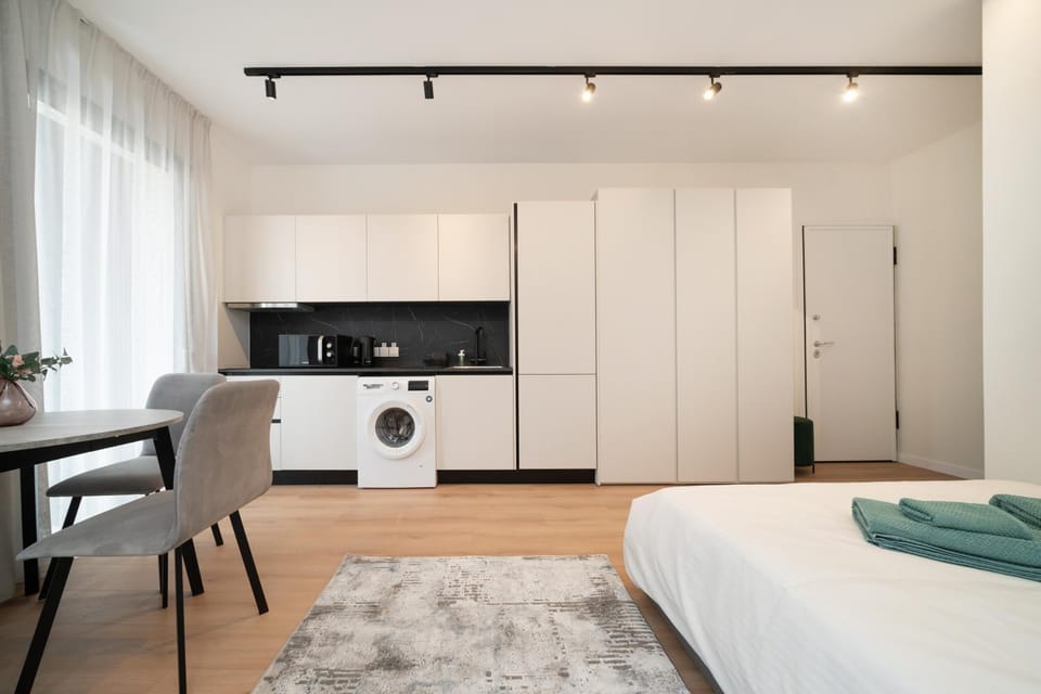 Bed, Kitchen or kitchenette, Photo of the whole room, Dining area, Bedroom, stove, towels, wardrobe, washing machine