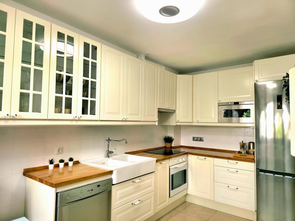 Kitchen or kitchenette, dishwasher, microwave, oven, stove, toaster