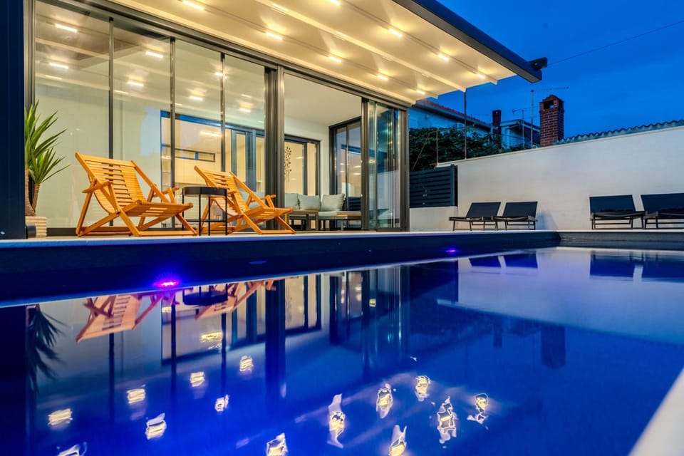 Patio, Night, Pool view, Swimming pool, sunbed