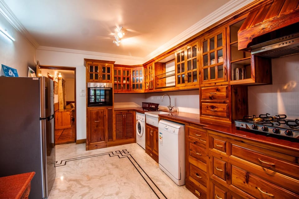 Kitchen or kitchenette, dishwasher, oven, stove