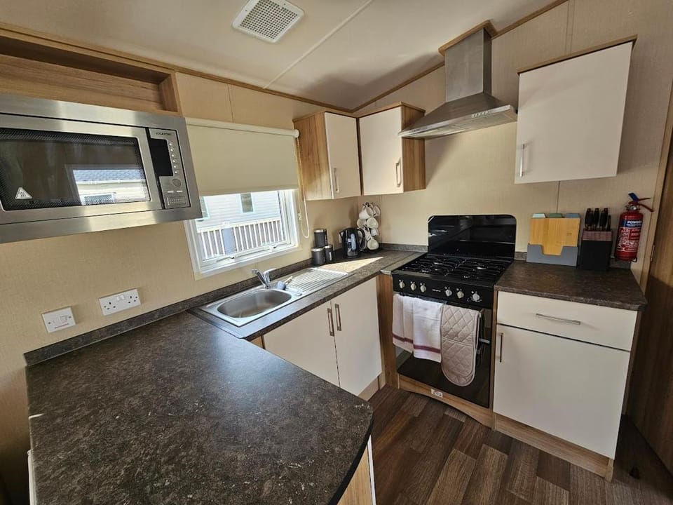 Kitchen or kitchenette, microwave, oven, stove, toaster