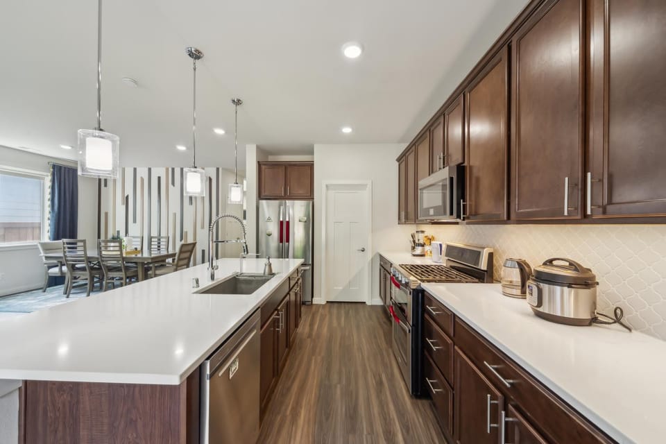 Kitchen or kitchenette, dishwasher, oven, stove