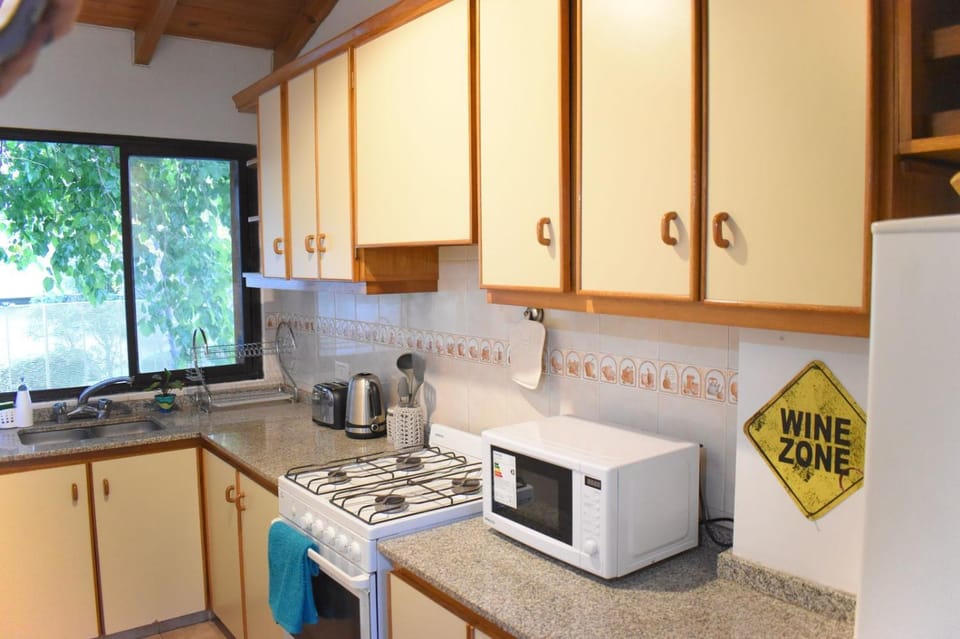 Kitchen or kitchenette, dishwasher, oven, stove, toaster