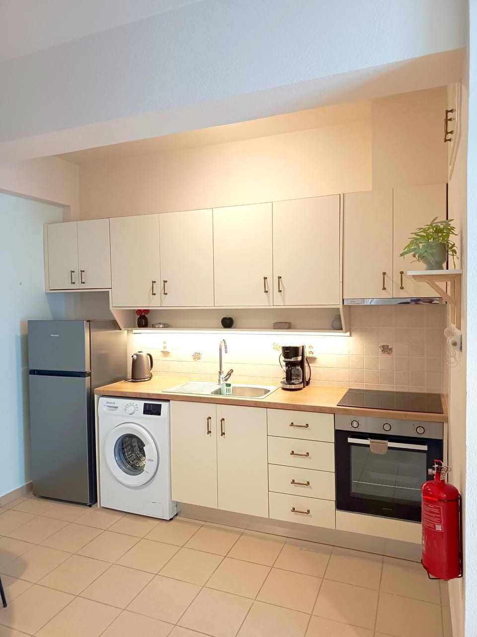 Kitchen or kitchenette, oven, stove, washing machine