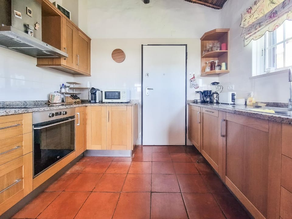Kitchen or kitchenette, dishwasher, oven, stove, toaster