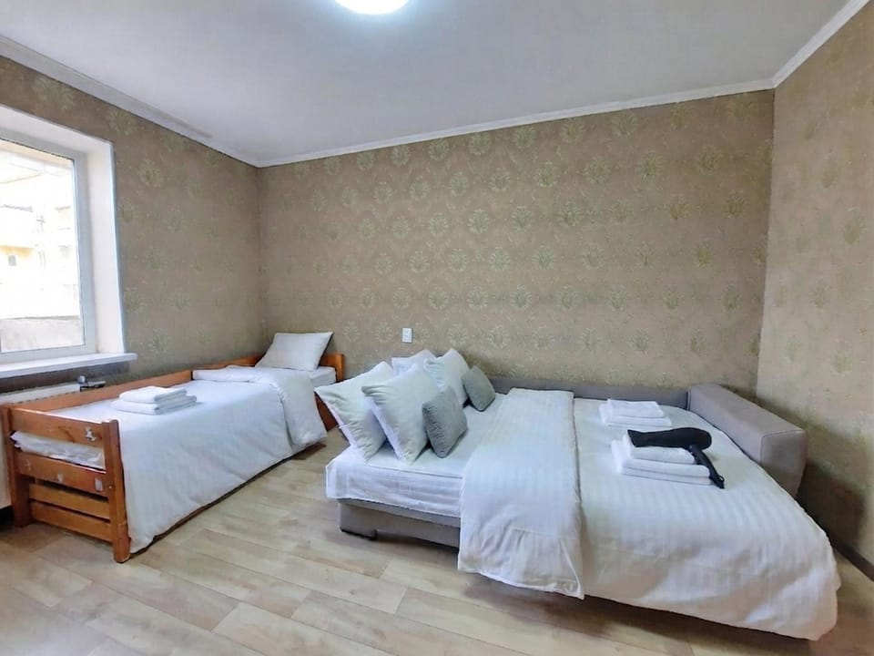 Bed, Photo of the whole room, Bedroom, hair dryier, towels