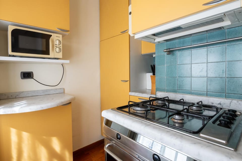 Kitchen or kitchenette, microwave, oven, stove