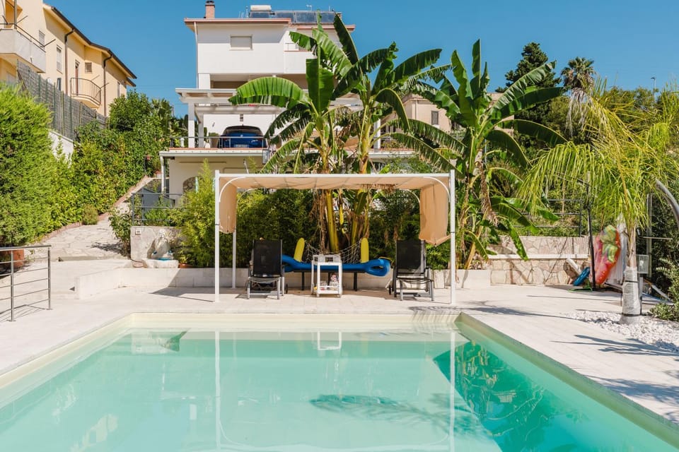 Property building, Living room, Swimming pool