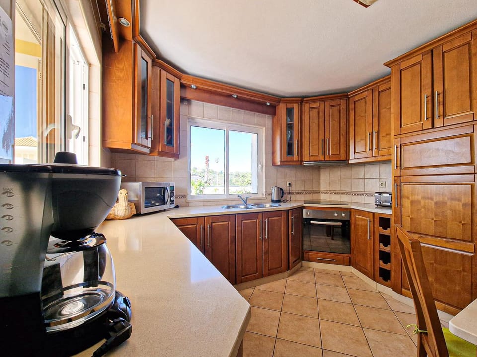 Kitchen or kitchenette, oven, stove, toaster