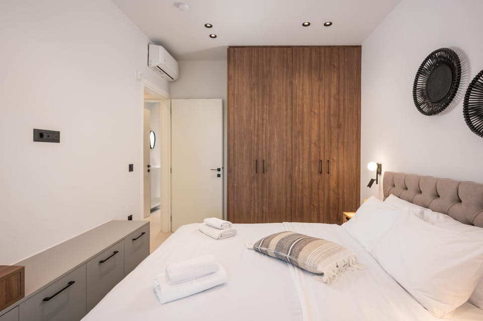 Bed, Bedroom, towels, wardrobe, air conditioner