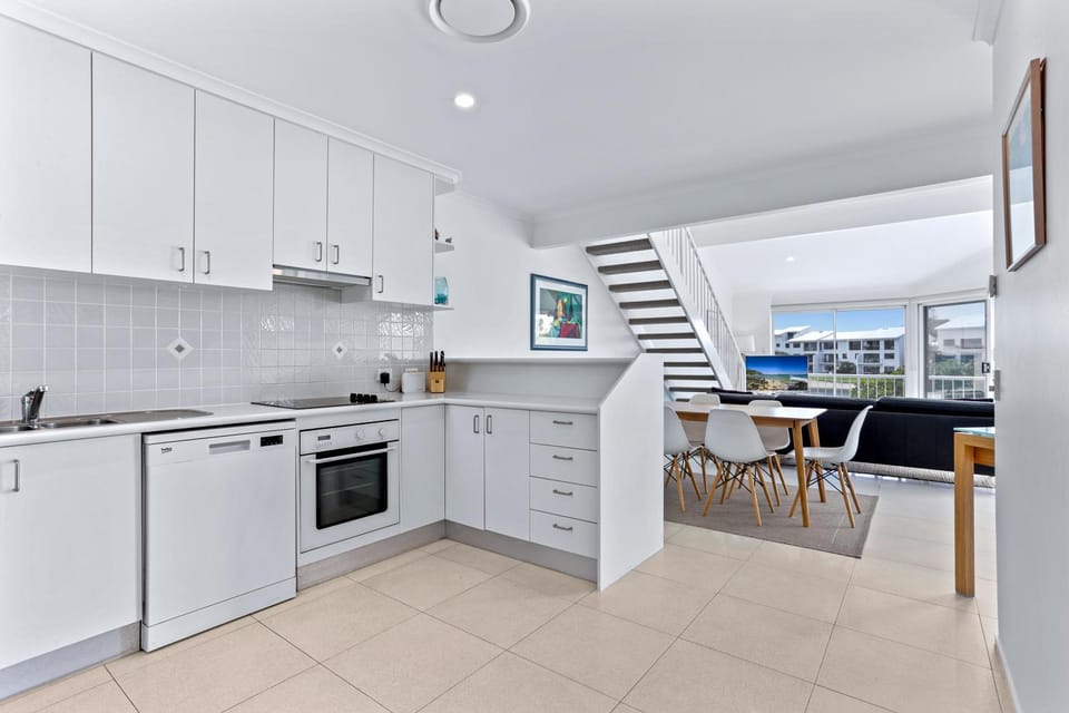 Kitchen or kitchenette, dishwasher, oven, stove, toaster
