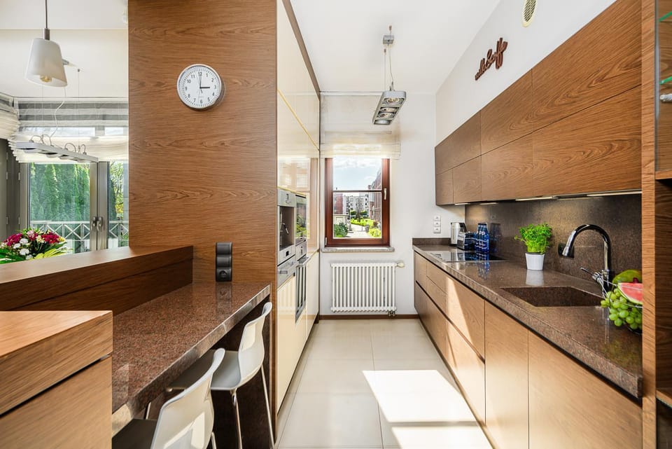 Kitchen or kitchenette, dishwasher, oven, stove