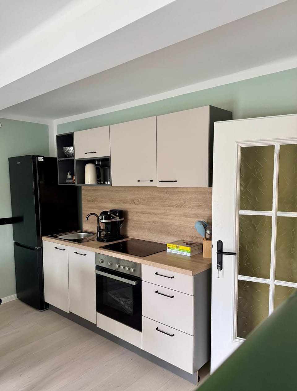 Kitchen or kitchenette, dishwasher, oven, stove, toaster
