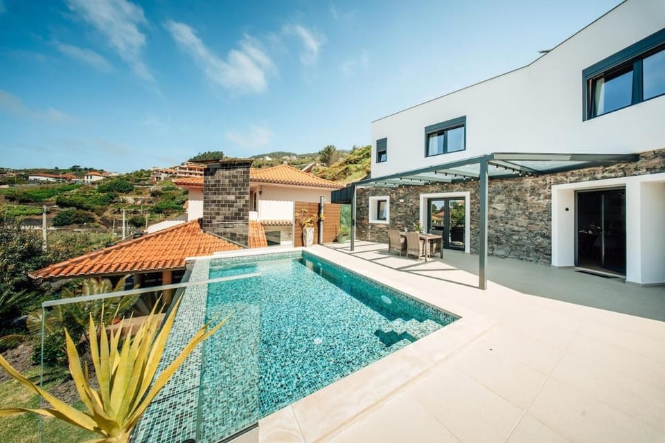 Property building, Patio, Pool view, Swimming pool, sunbed