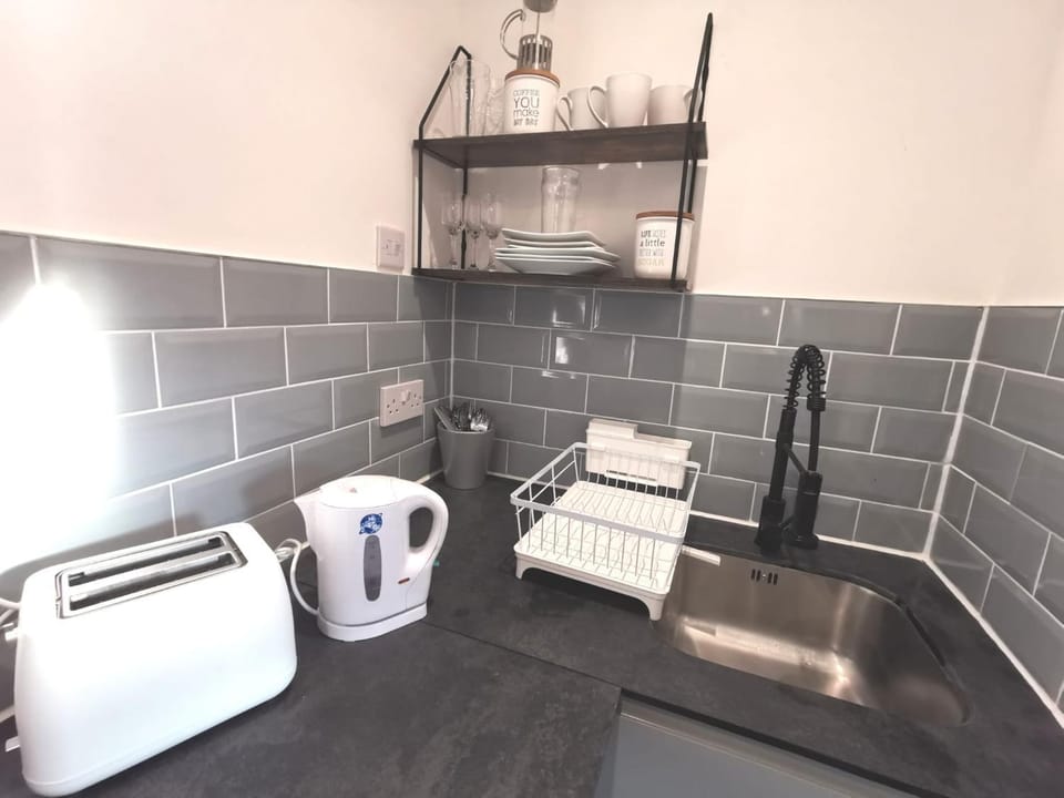 Kitchen or kitchenette, stove, toaster