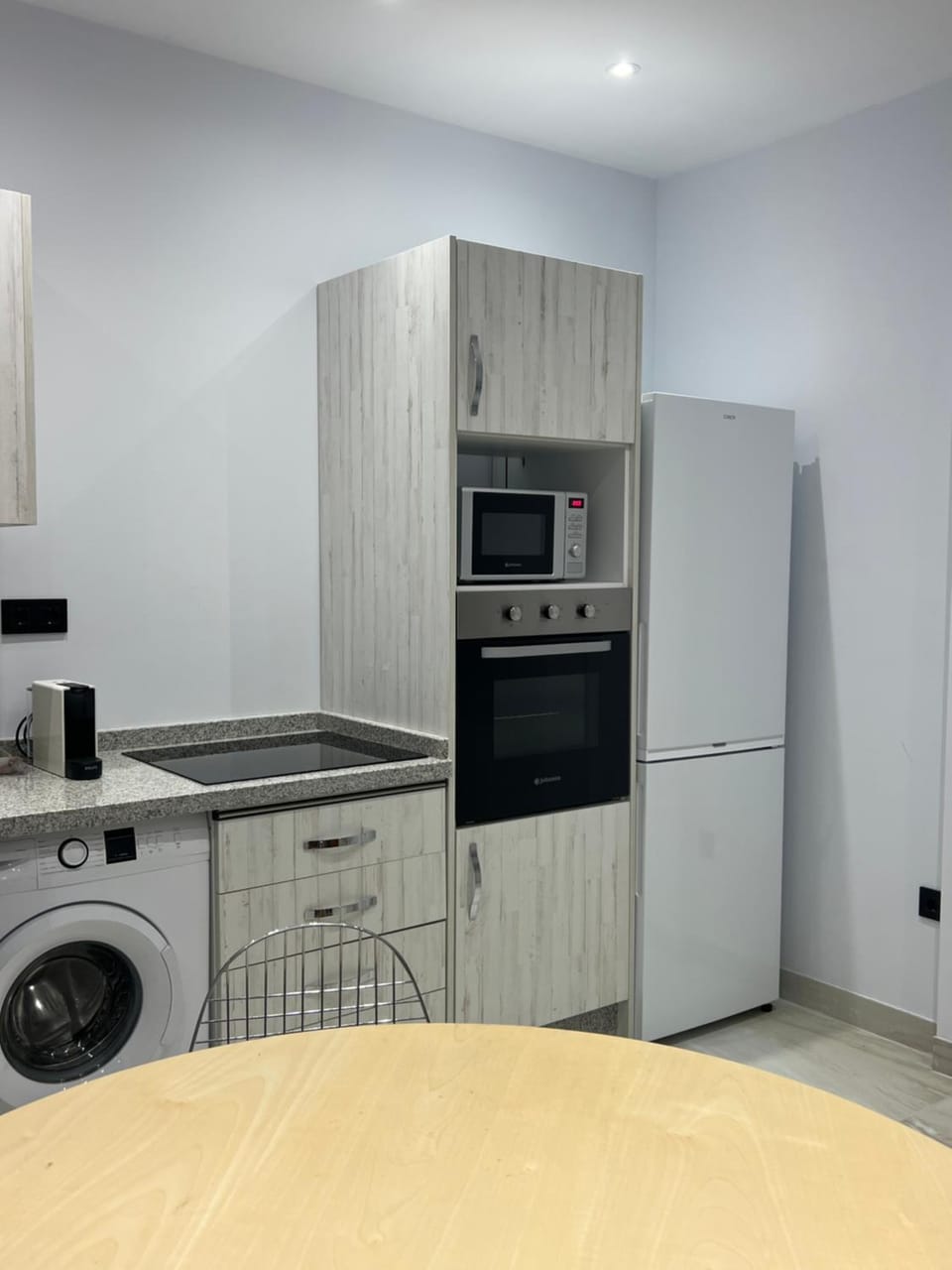 Kitchen or kitchenette, oven, stove, washing machine