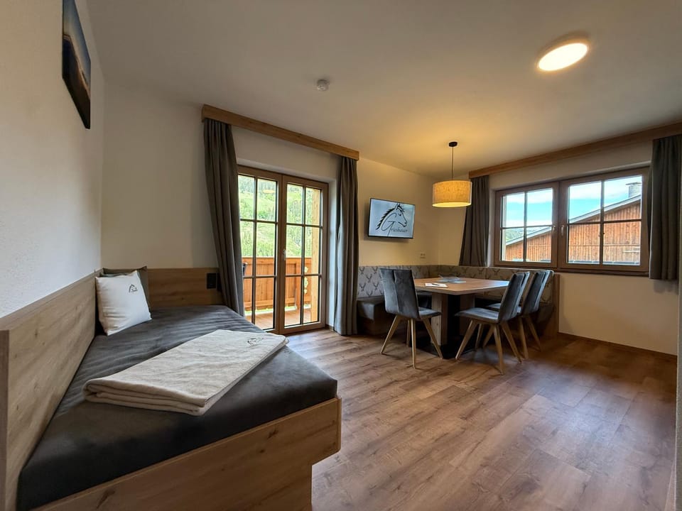 Bed, TV and multimedia, Living room, Seating area, Dining area