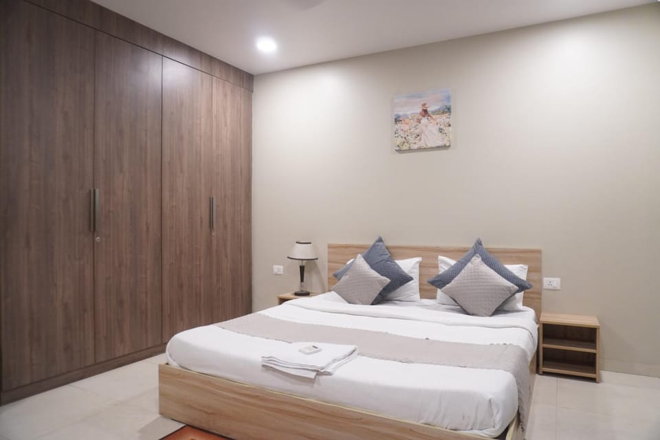 Bed, towels, wardrobe