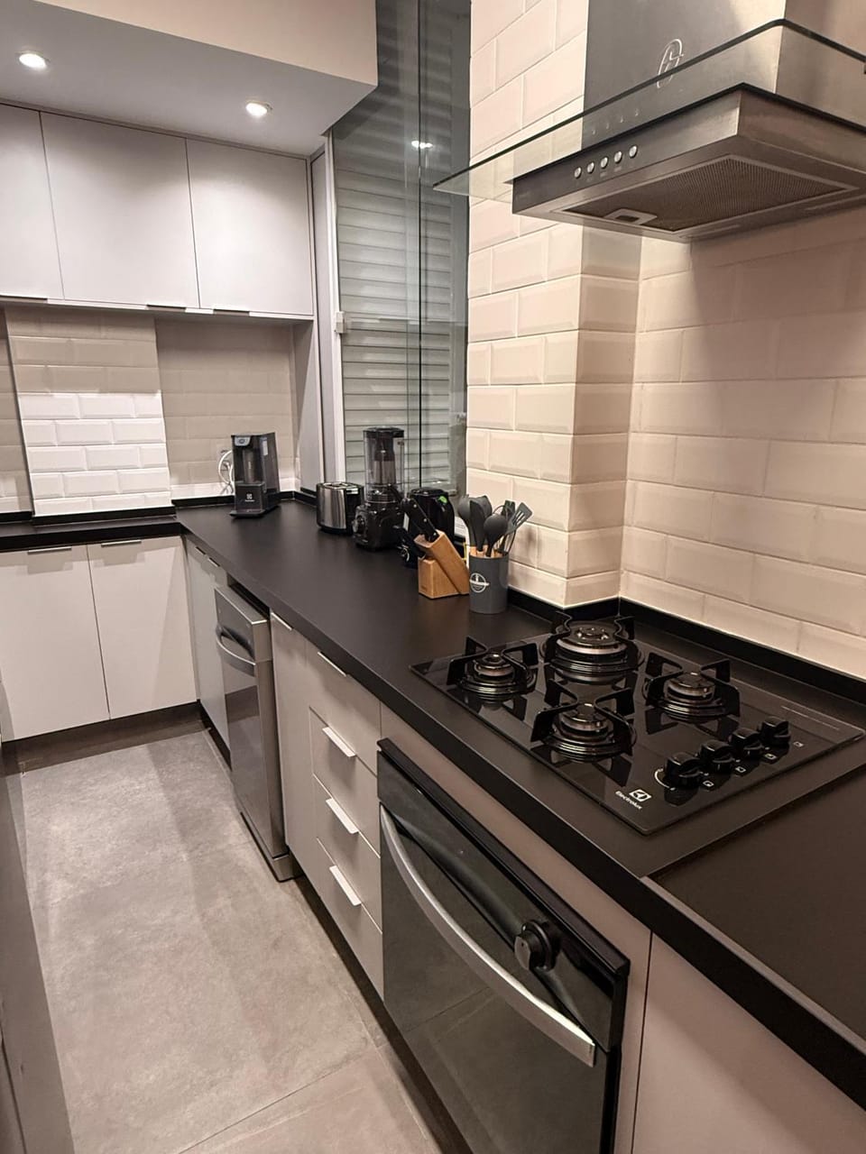 Kitchen or kitchenette, dishwasher, oven, laundry, kitchen