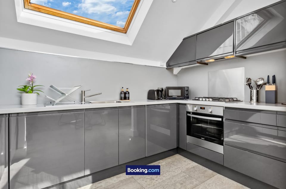 Kitchen or kitchenette, dishwasher, oven, stove, toaster