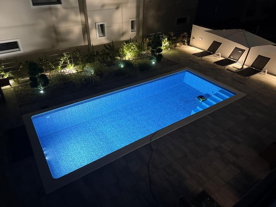 Patio, Night, Pool view, Swimming pool, sunbed
