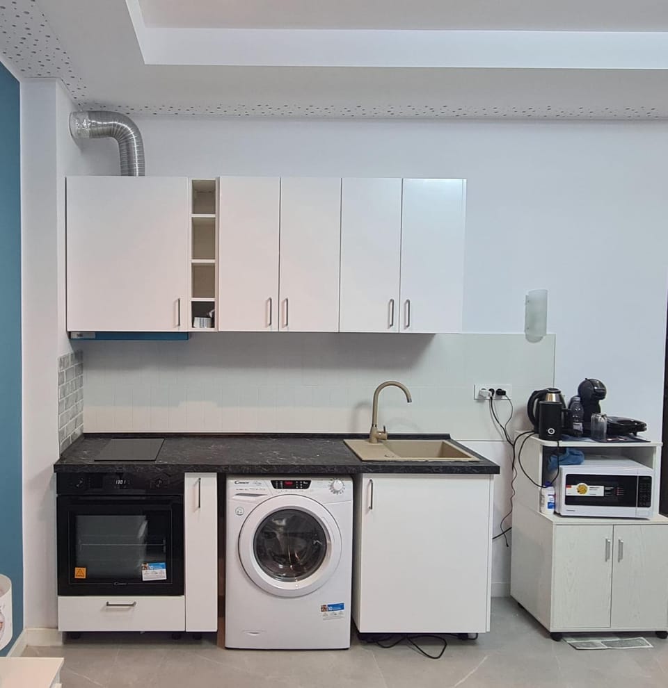 Kitchen or kitchenette, dishwasher, oven, stove, washing machine
