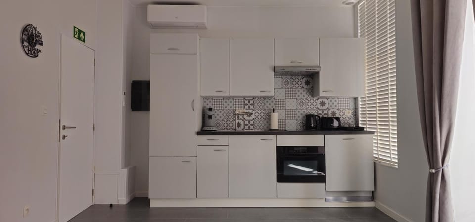 Kitchen or kitchenette, oven, stove