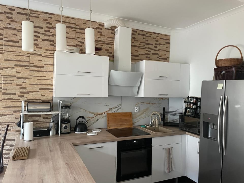 Kitchen or kitchenette, dishwasher, oven, stove, toaster