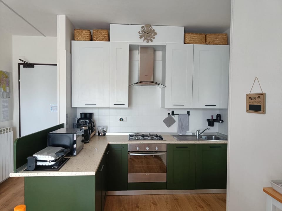 Kitchen or kitchenette, dishwasher, oven, stove, toaster