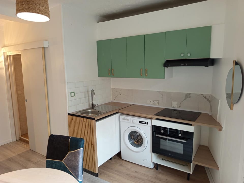 Kitchen or kitchenette, dishwasher, oven, stove, washing machine