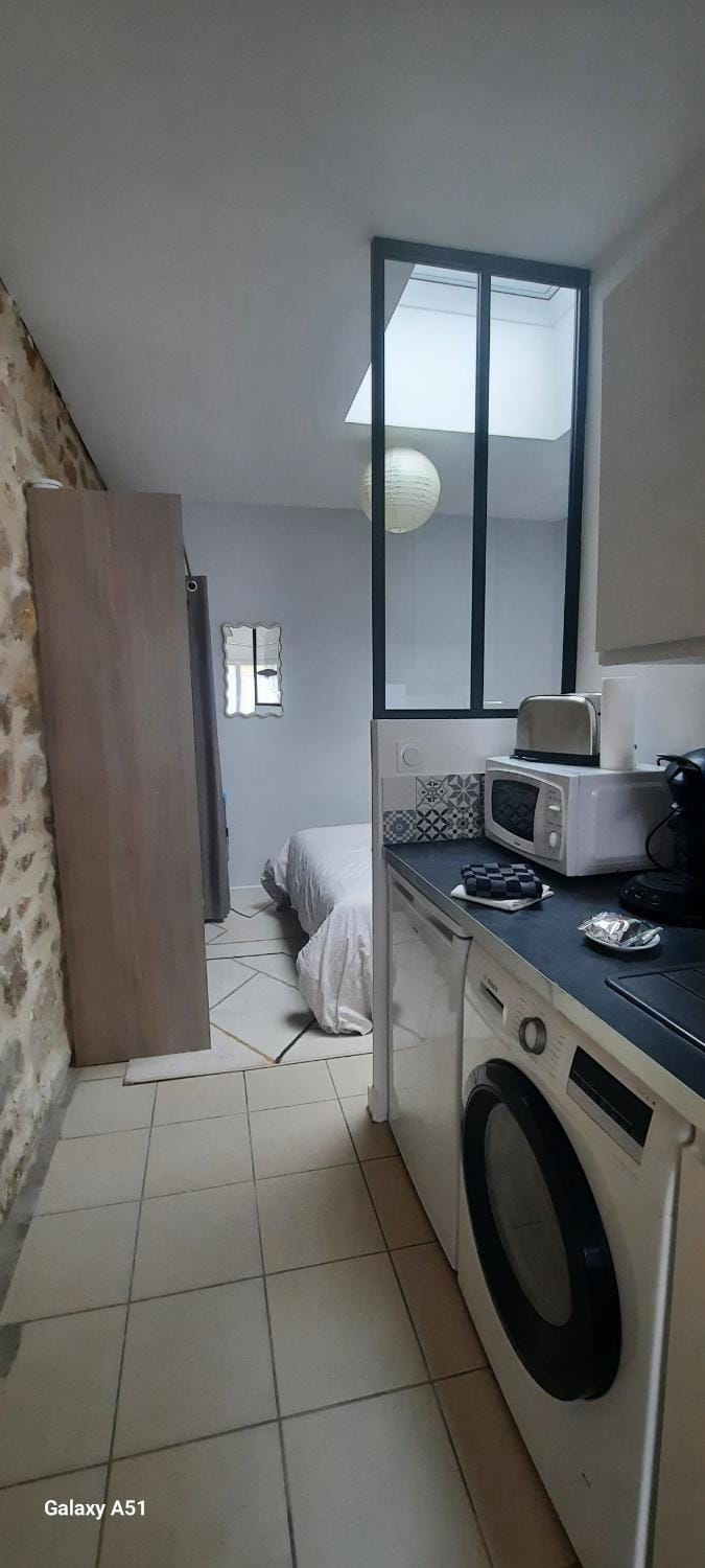 Kitchen or kitchenette, washing machine