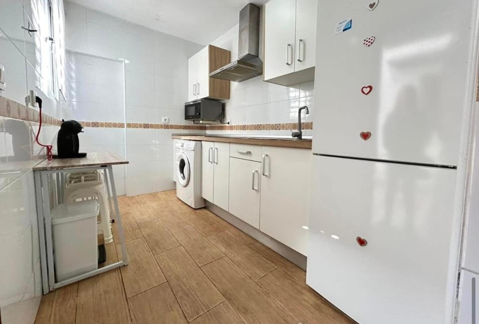 Kitchen or kitchenette, dishwasher, stove, washing machine