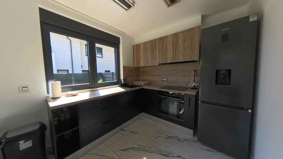 Kitchen or kitchenette, dishwasher, oven, stove