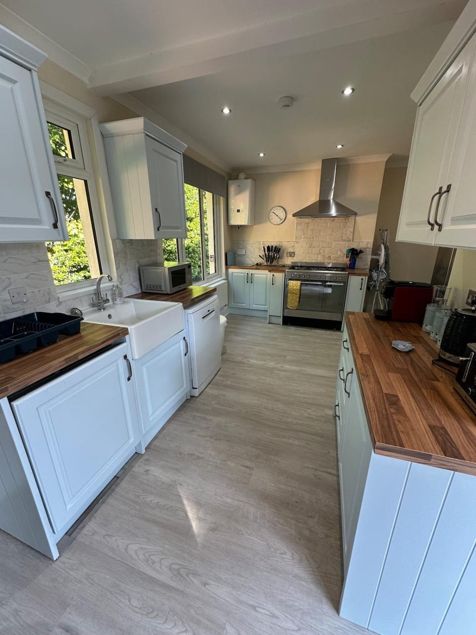 Kitchen or kitchenette, dishwasher, oven, stove