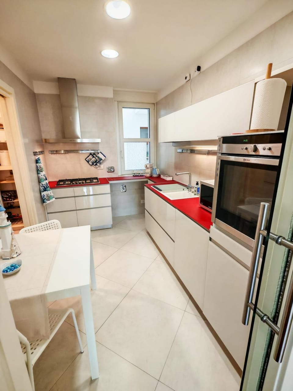 Kitchen or kitchenette, dishwasher, oven, stove