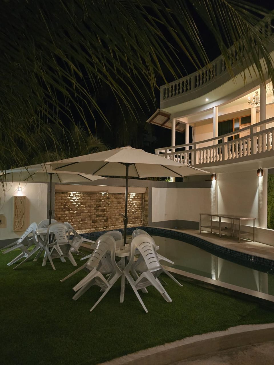 Property building, Patio, Night, Pool view, Swimming pool, sunbed