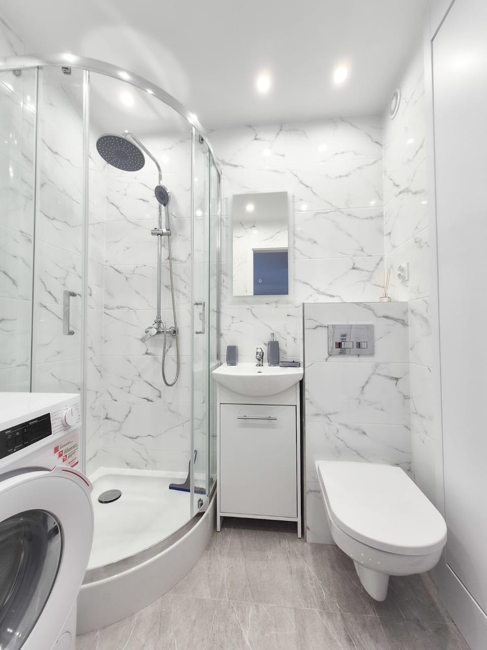 Shower, Toilet, Bathroom, towels, washing machine, dryer
