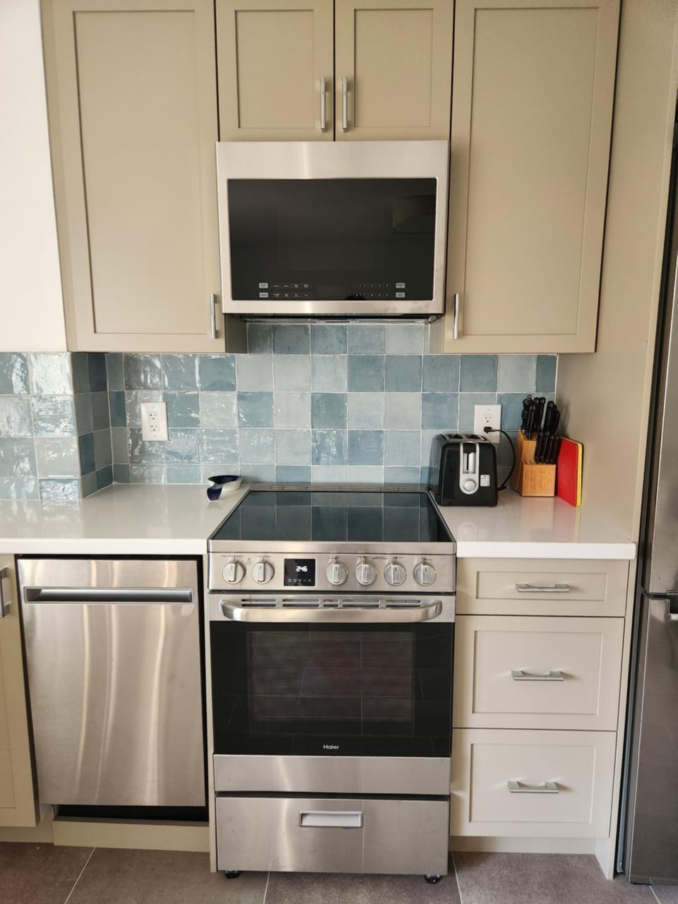 Kitchen or kitchenette, dishwasher, oven, stove, toaster
