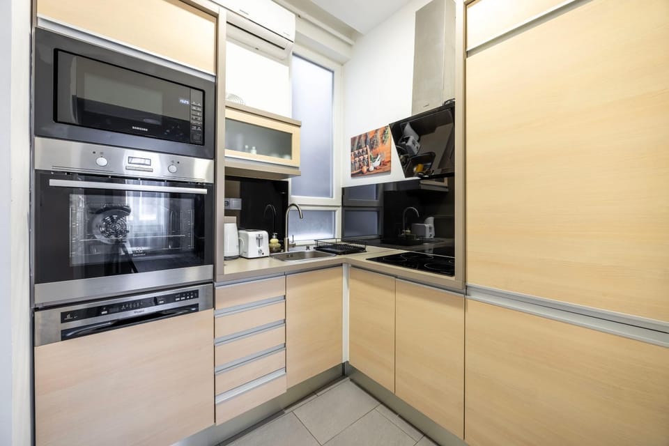 Kitchen or kitchenette, dishwasher, oven, stove