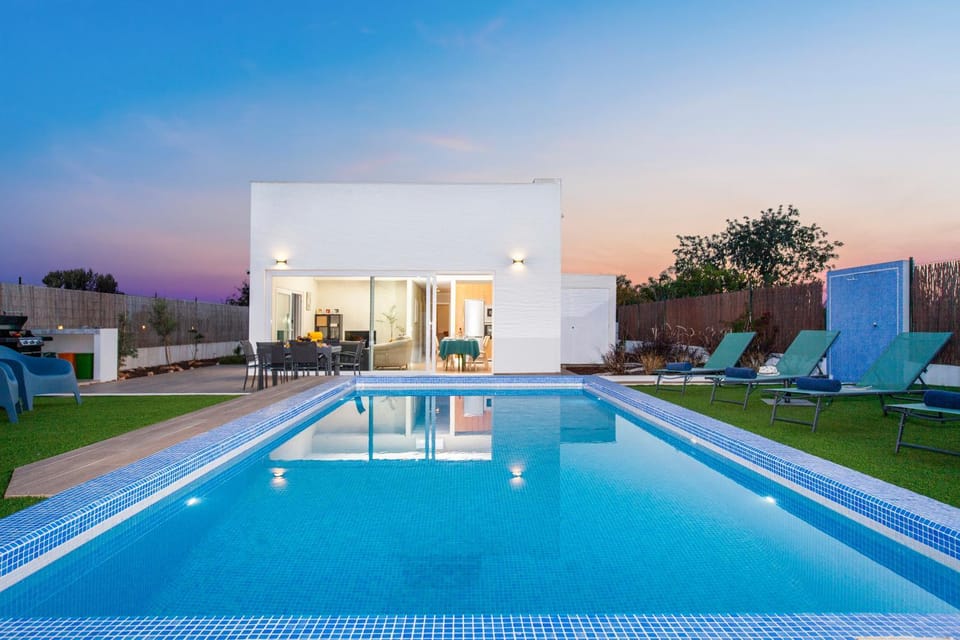 Property building, Patio, Pool view, Swimming pool, Sunset, sunbed