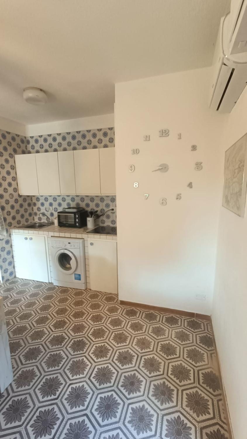 Kitchen or kitchenette, oven, stove, washing machine