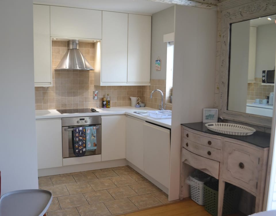 Kitchen or kitchenette, dishwasher, oven, stove, toaster