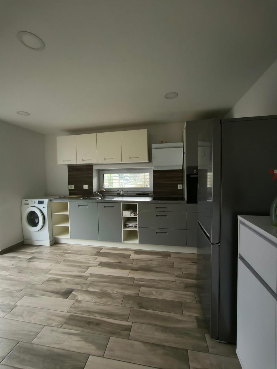 Kitchen or kitchenette, dishwasher, oven, stove
