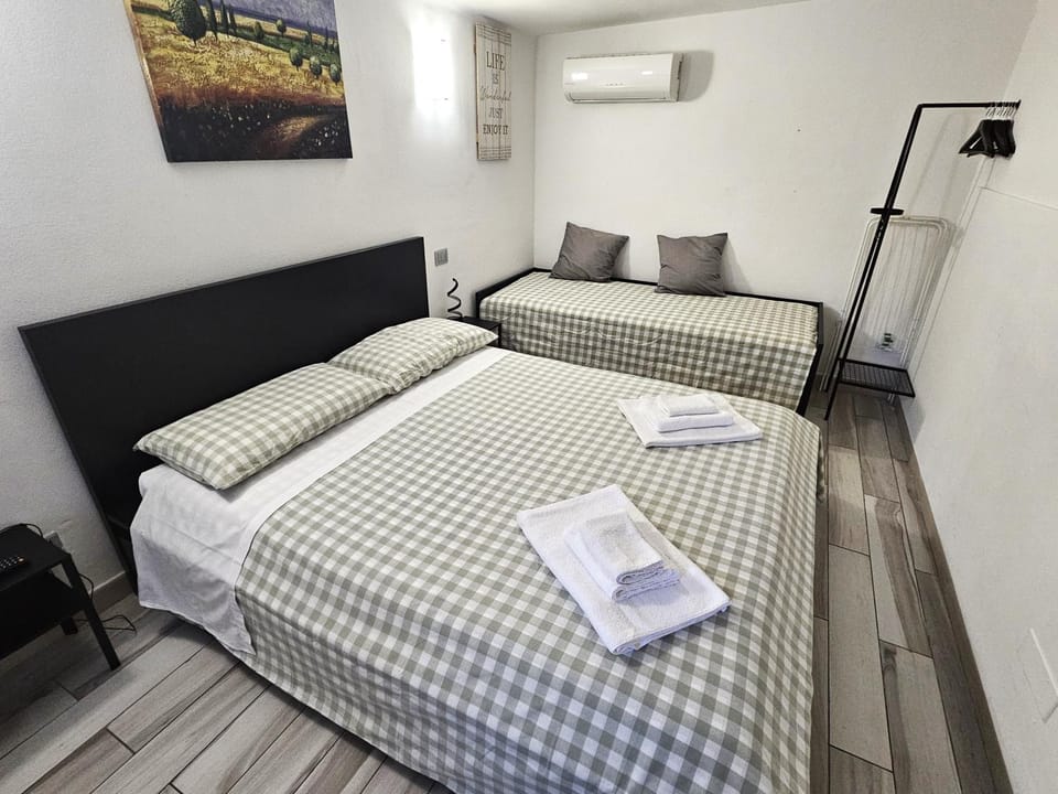Bed, Photo of the whole room, Bedroom, towels, air conditioner