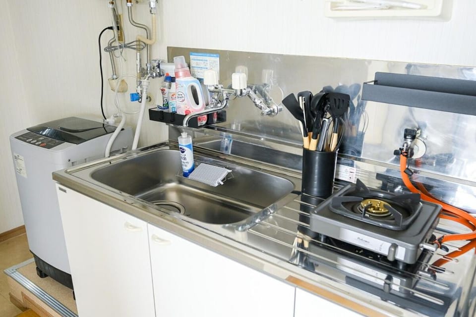 Kitchen or kitchenette, washing machine