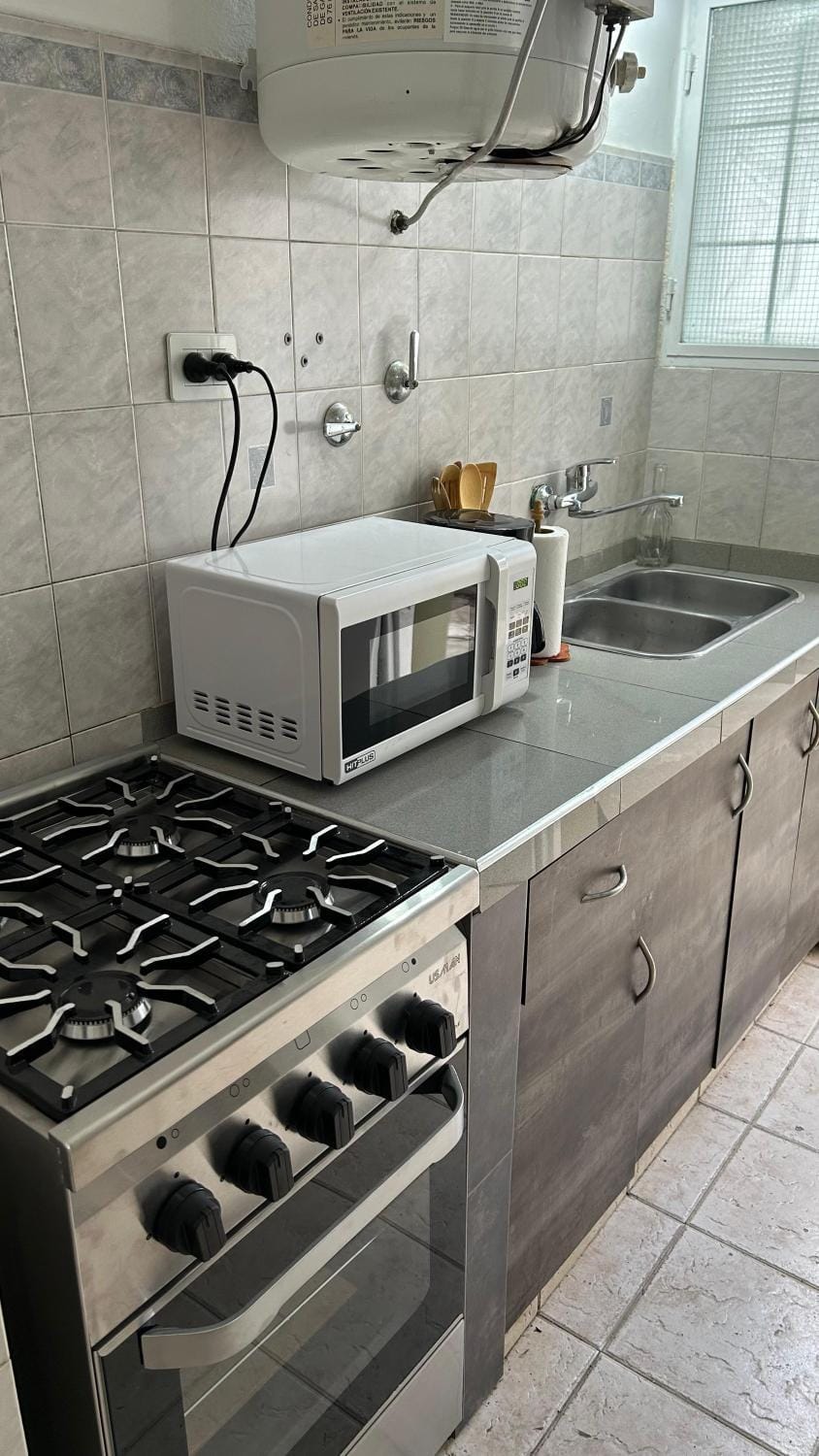 Kitchen or kitchenette, microwave, stove