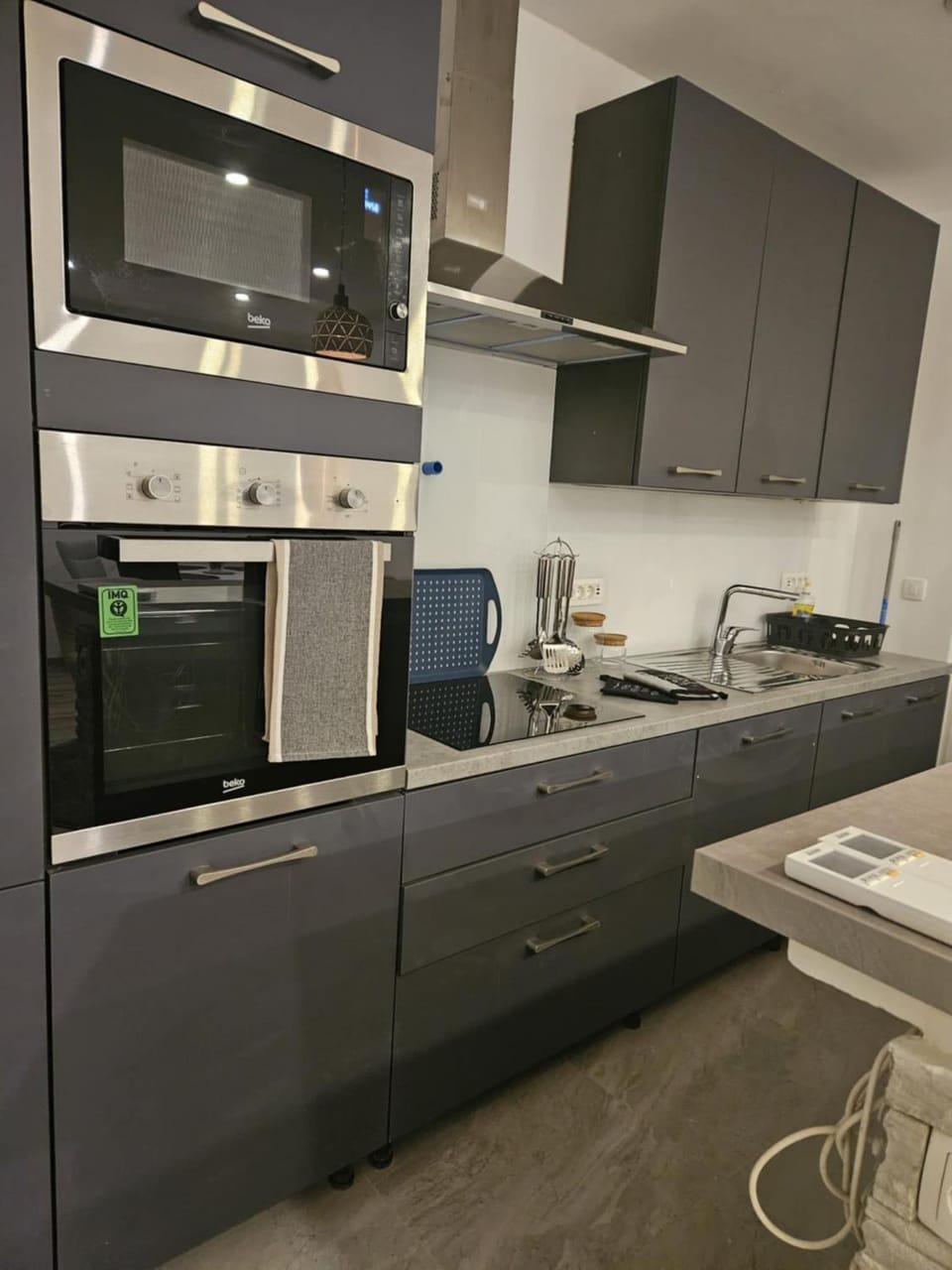Kitchen or kitchenette, dishwasher, oven, stove