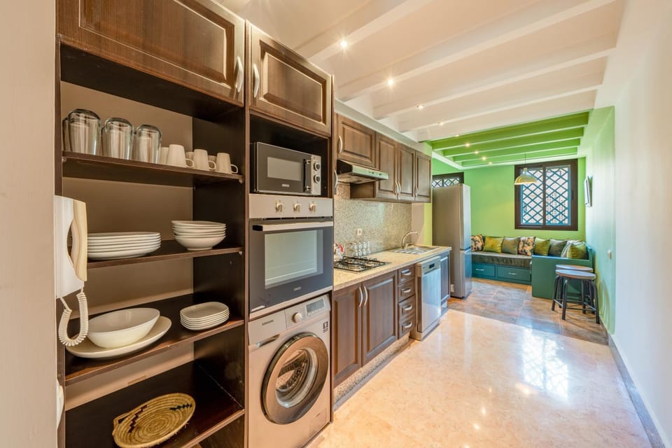 Kitchen or kitchenette, dishwasher, oven, stove, toaster, washing machine