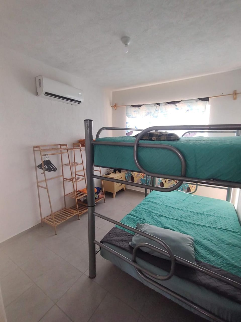 Photo of the whole room, bunk bed, air conditioner