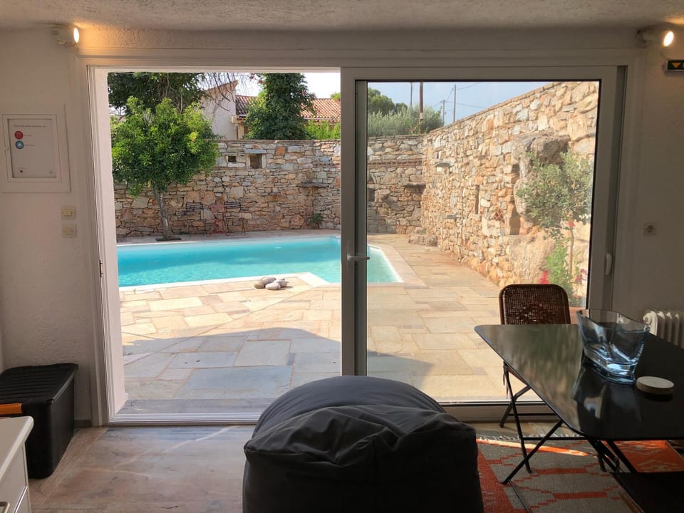 Living room, Seating area, Dining area, Pool view